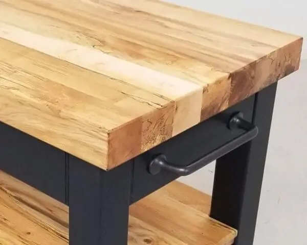 A close up of a butcher block cart in black.