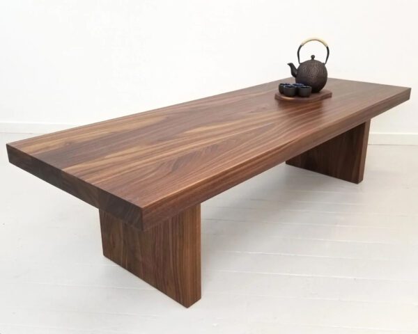 A wooden panel coffee table with decorations on top of it.