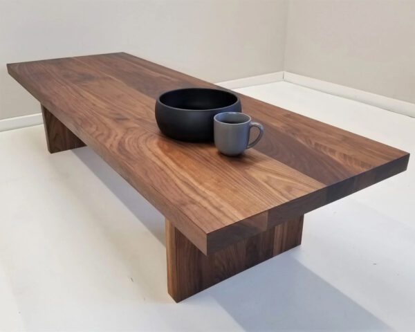 A wooden panel coffee table with decorations on top of it.