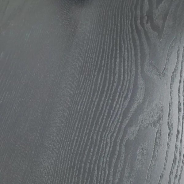 A close up of a black Wood & Finish Options floor with a polished finish.