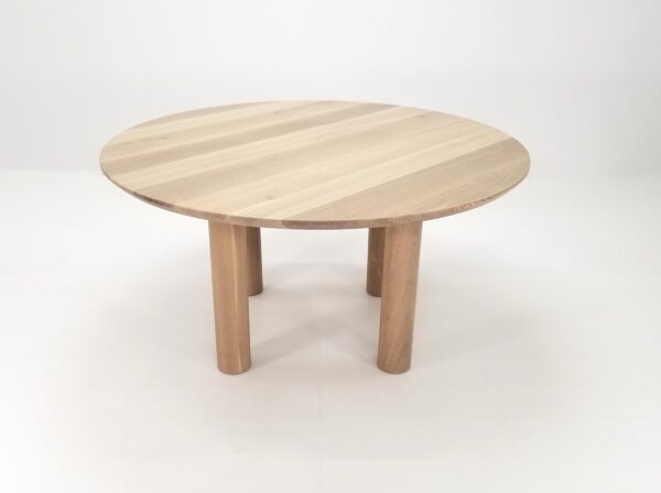 A natural white oak round dining table.