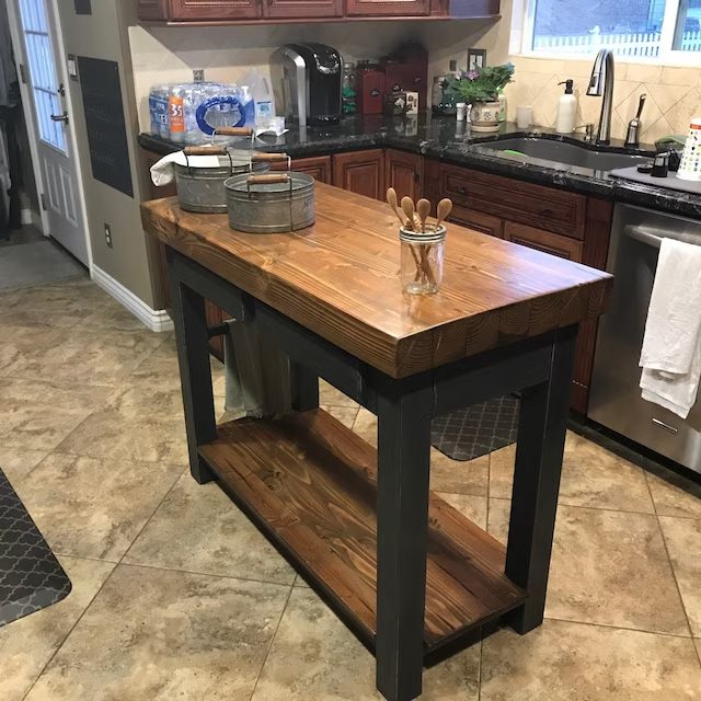 A kitchen island with a wooden top featured in client photos.