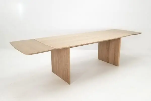 A white oak table with a beveled edge and 18" table extensions.