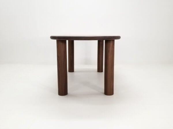 A oval walnut dining table.