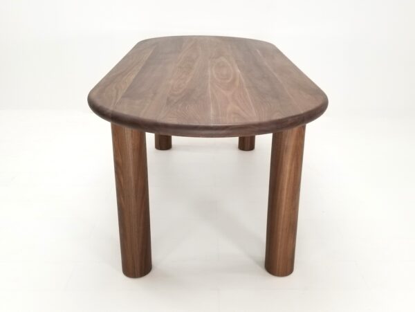 A oval walnut dining table.