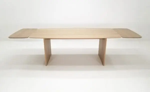 A white oak table with a beveled edge and 18" table extensions.