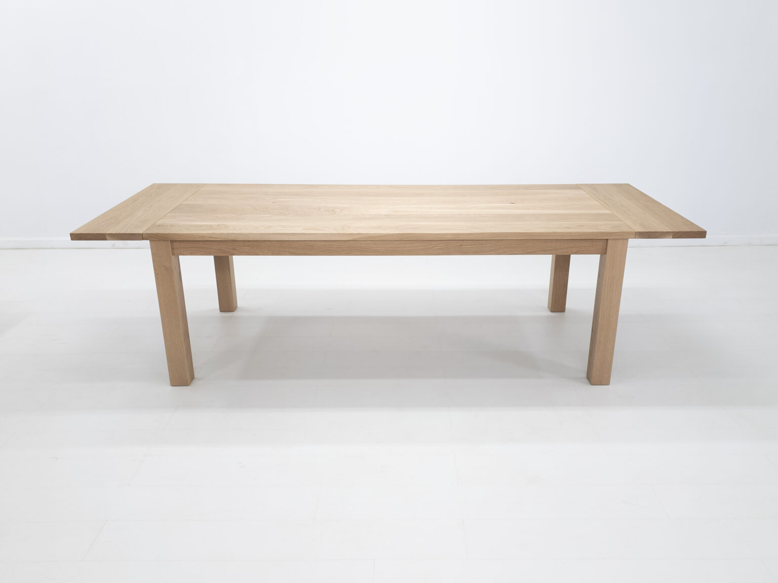 Light oak extending dining table