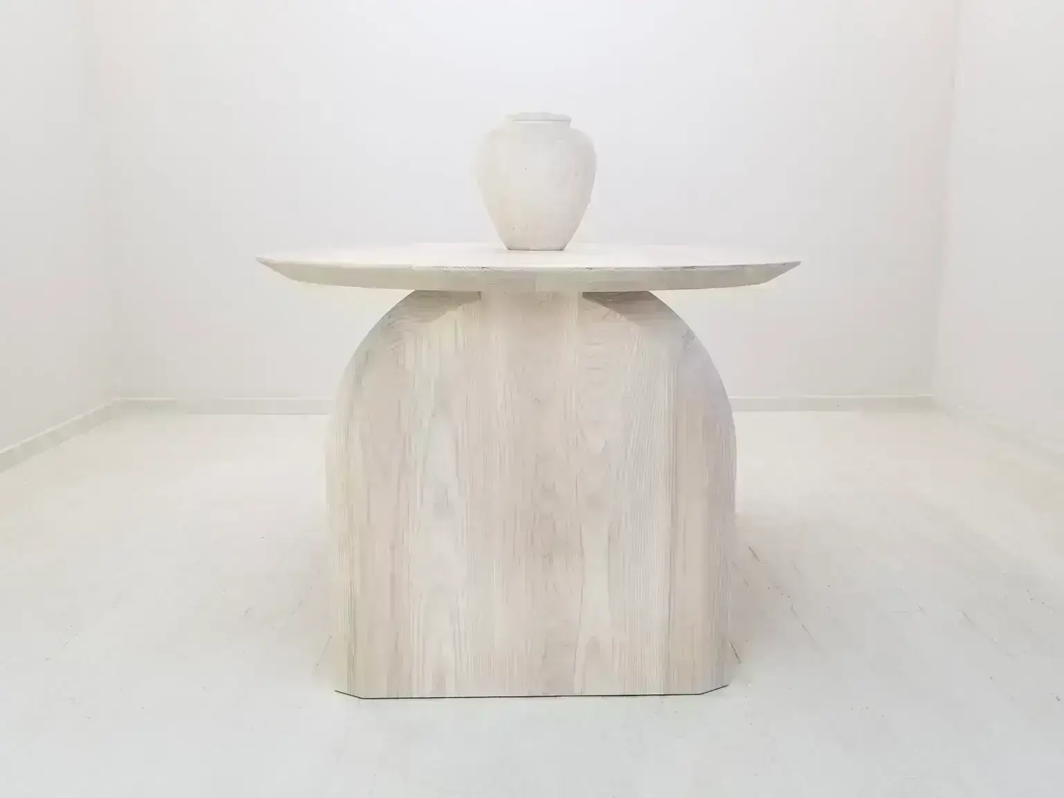 White wood table with stone vase