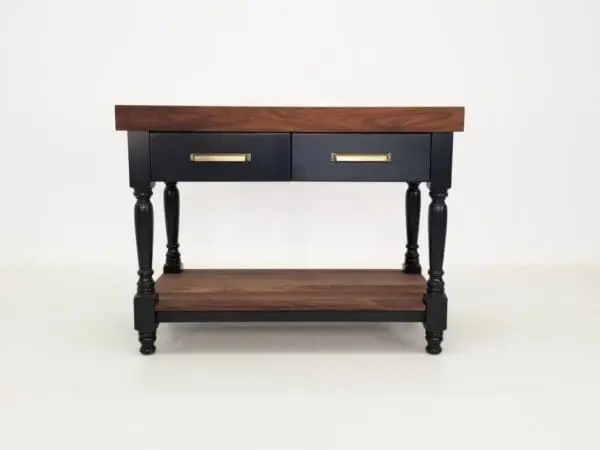 The front end of a walnut butcher block kitchen island.