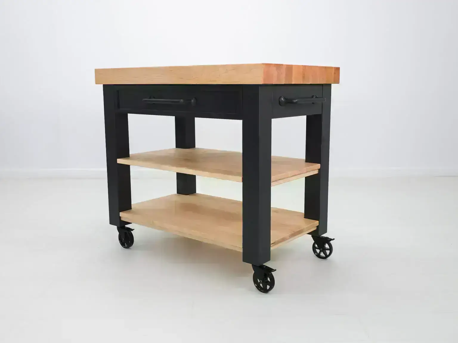 Black kitchen island with wooden top