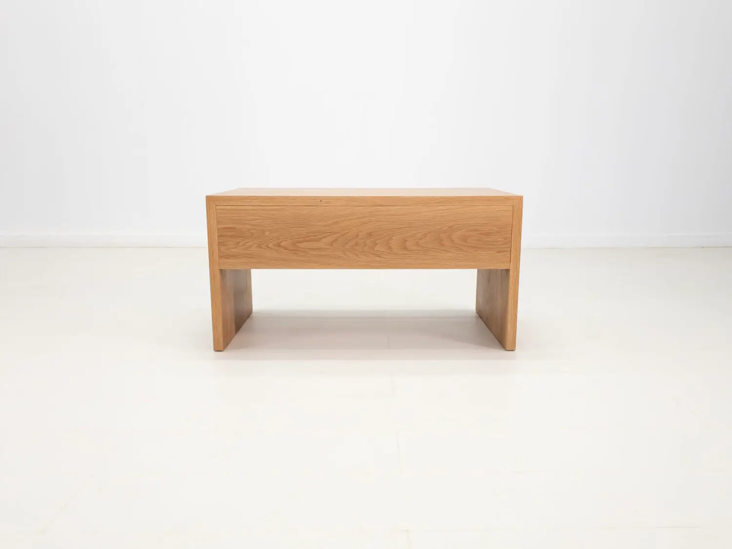 DREW coffee table in natural white oak featuring a seamless grain pattern and modern design