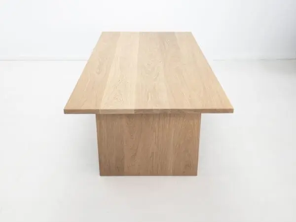 A white oak LILY dining table with a 1.5" thick table top.