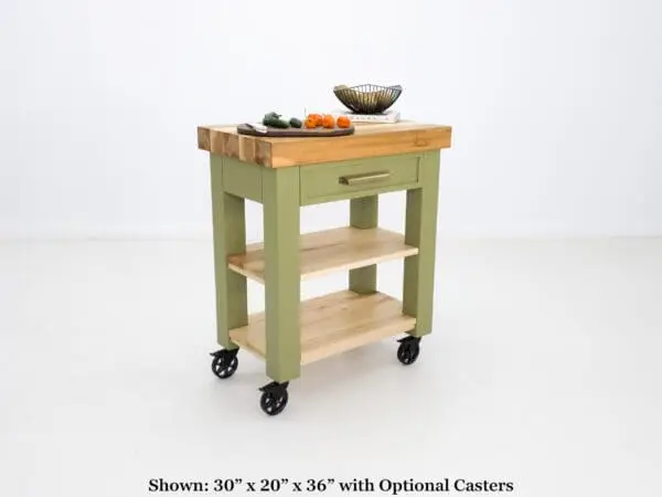 Green kitchen cart with wooden top and casters.