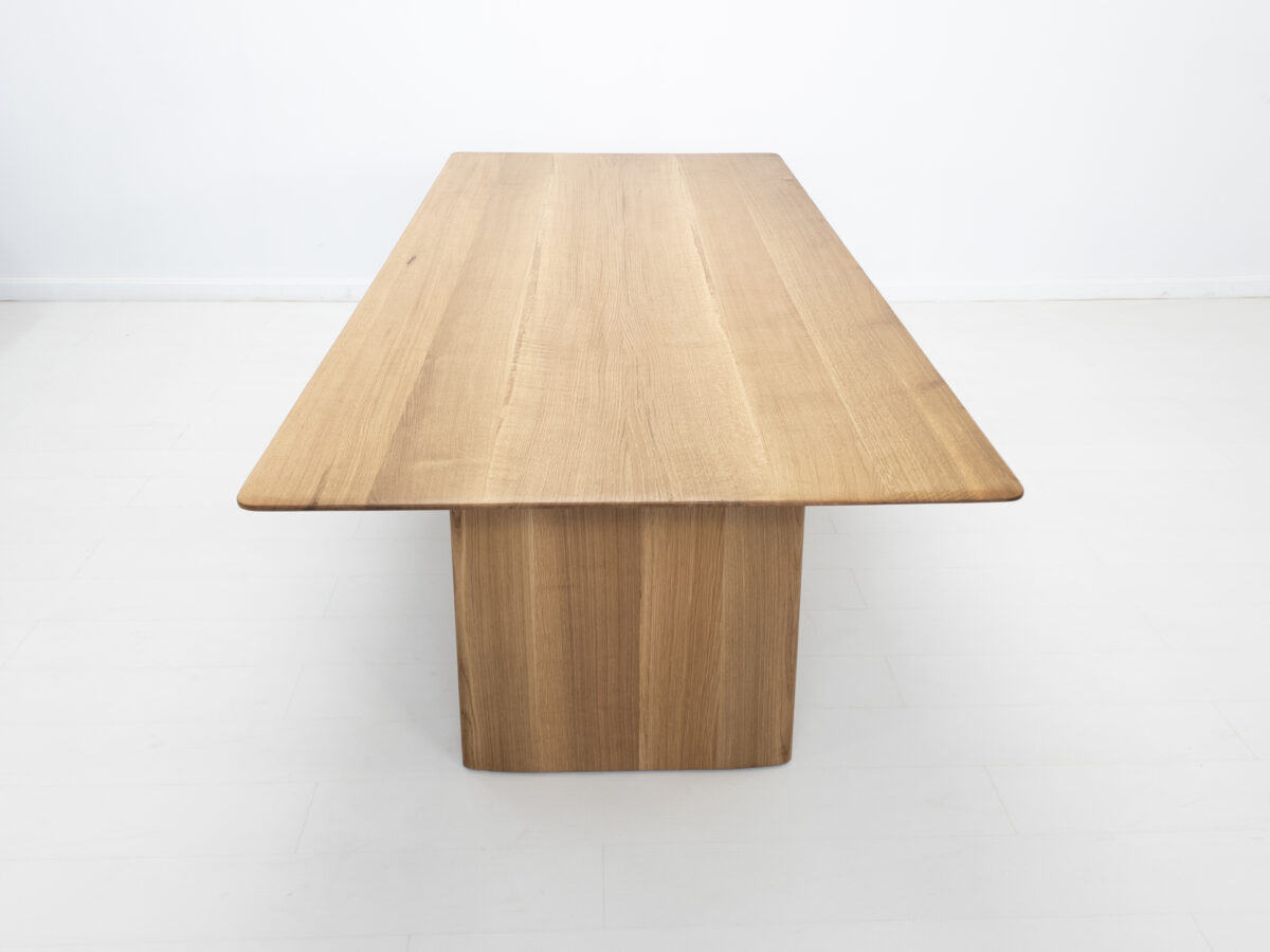 Close up of the hand applied hardwax oil finish highlighting the natural wood grain of the THEO dining table