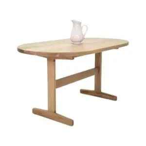 Oval wooden table with pitcher on top.