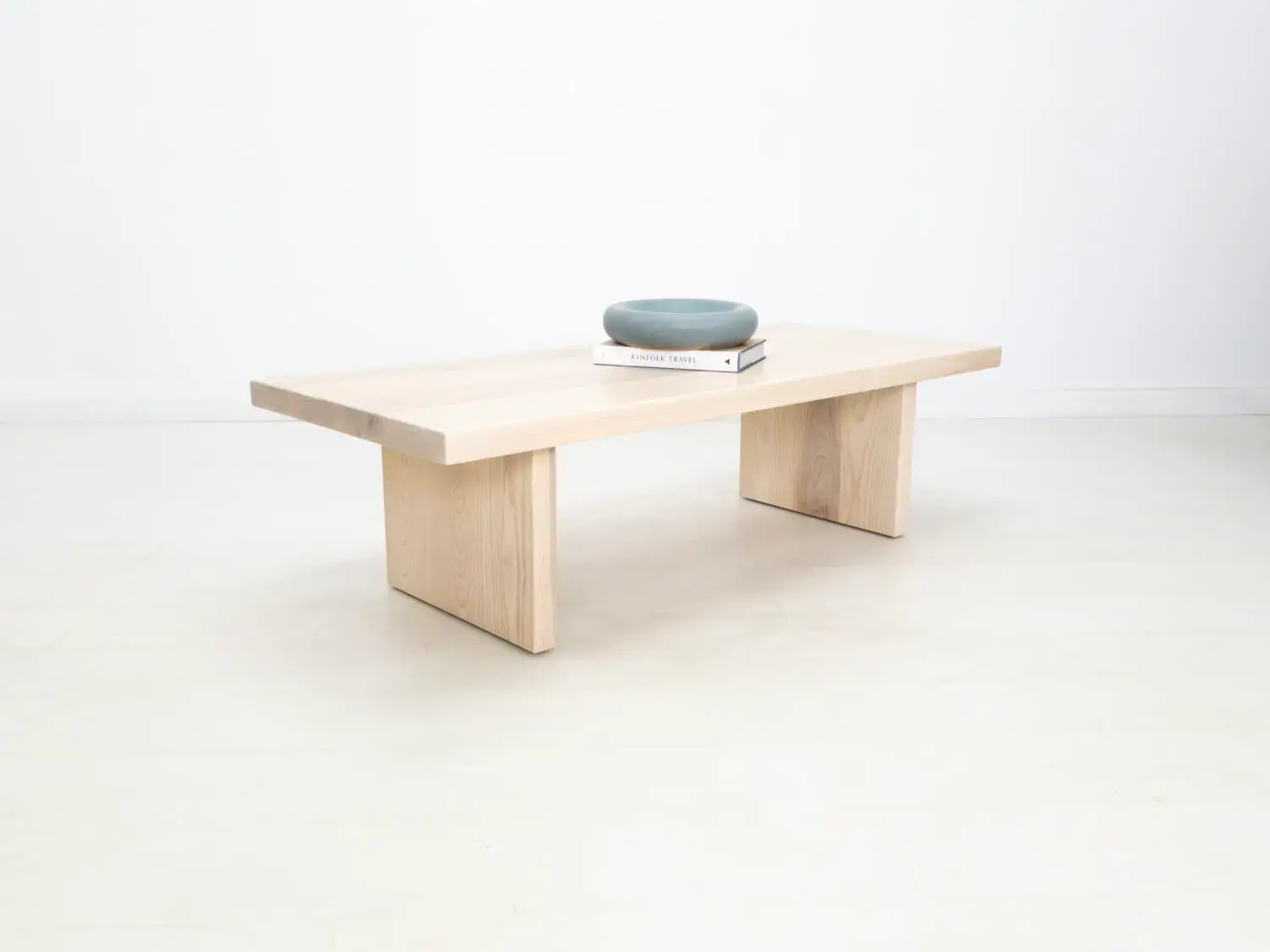 LILY coffee table in solid sunwashed ash with a 2 inch thick slab style top and panel legs