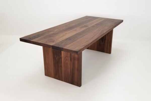 A large 2" thick walnut dining table.