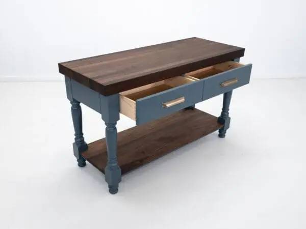 A turned leg butcher block kitchen island.