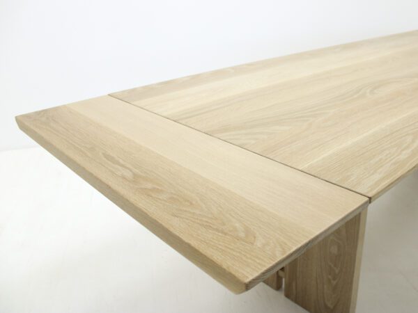 A panel table with split legs.