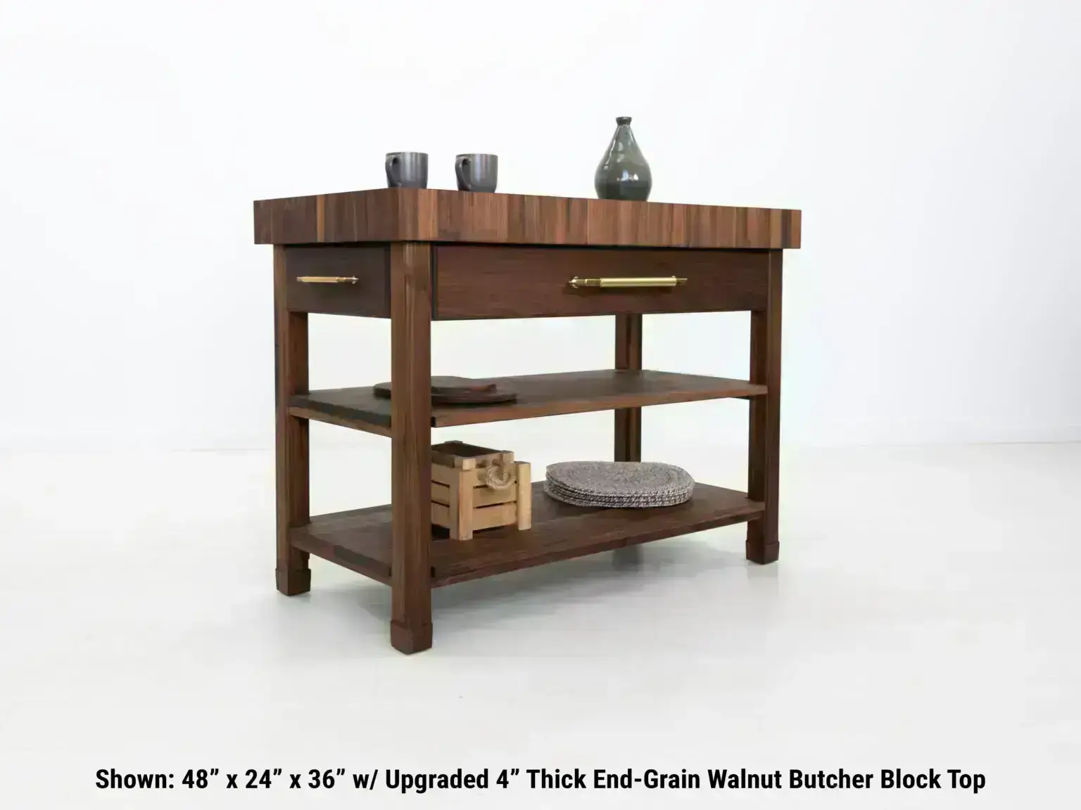 Custom made walnut kitchen island with spacious shelves and 4 inch thick butcher block top