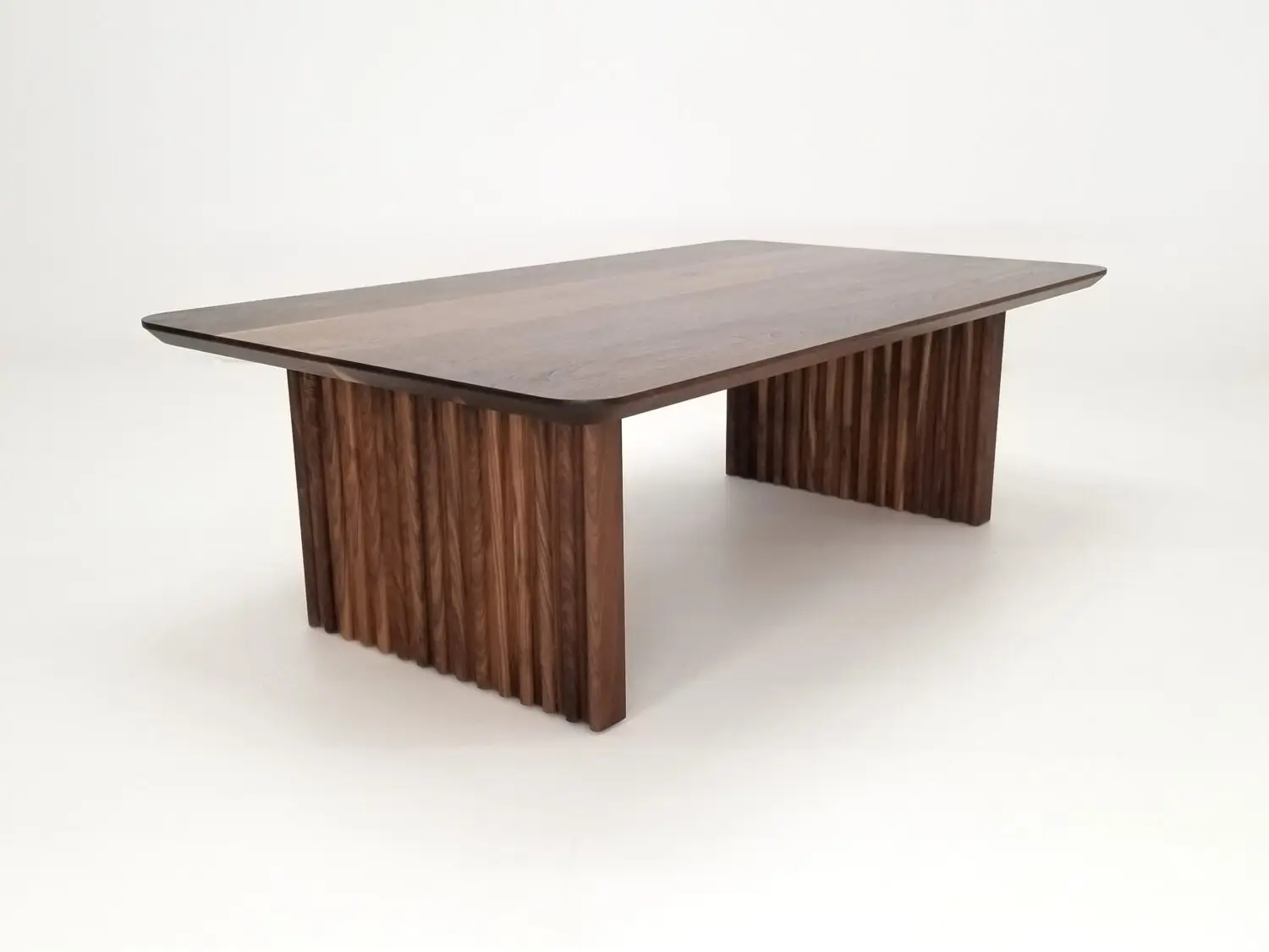 OWEN coffee table in solid walnut with a 1¼ inch thick tabletop and rounded corners