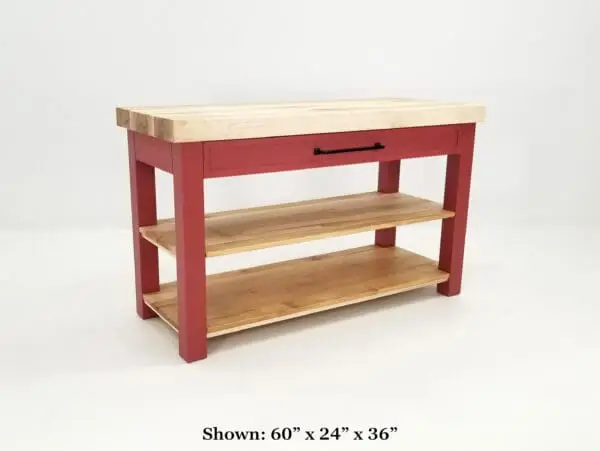 Red kitchen island with wood top and shelves.