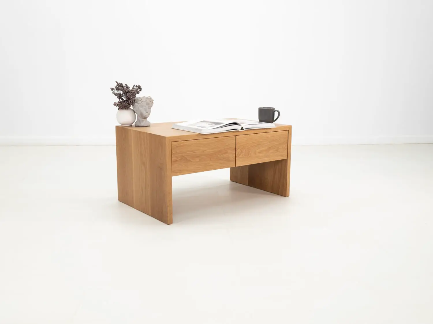 Modern white oak coffee table with a continuous grain pattern and sleek silhouette