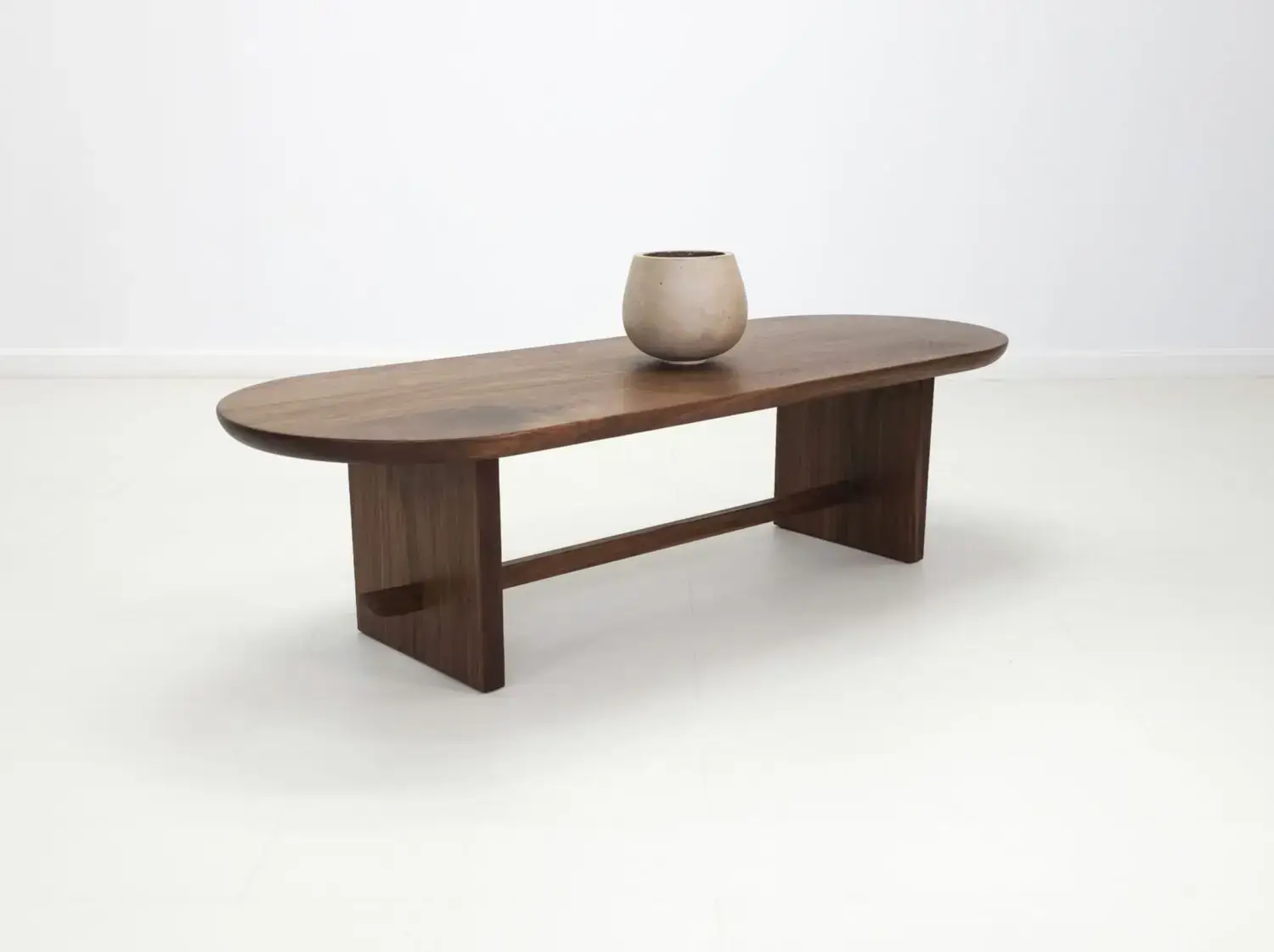 MIRA coffee table in solid American hardwood with a 1½ inch thick capsule shaped top