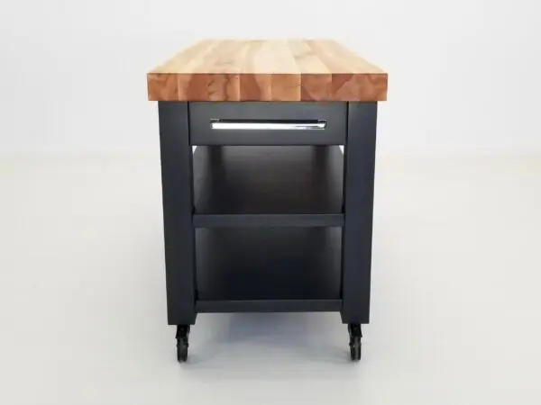 A side view of a black butcher block cart.