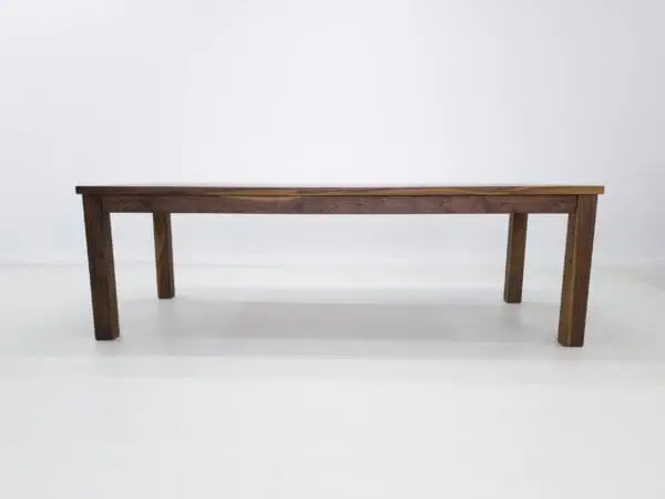 A parsons style walnut dining table.