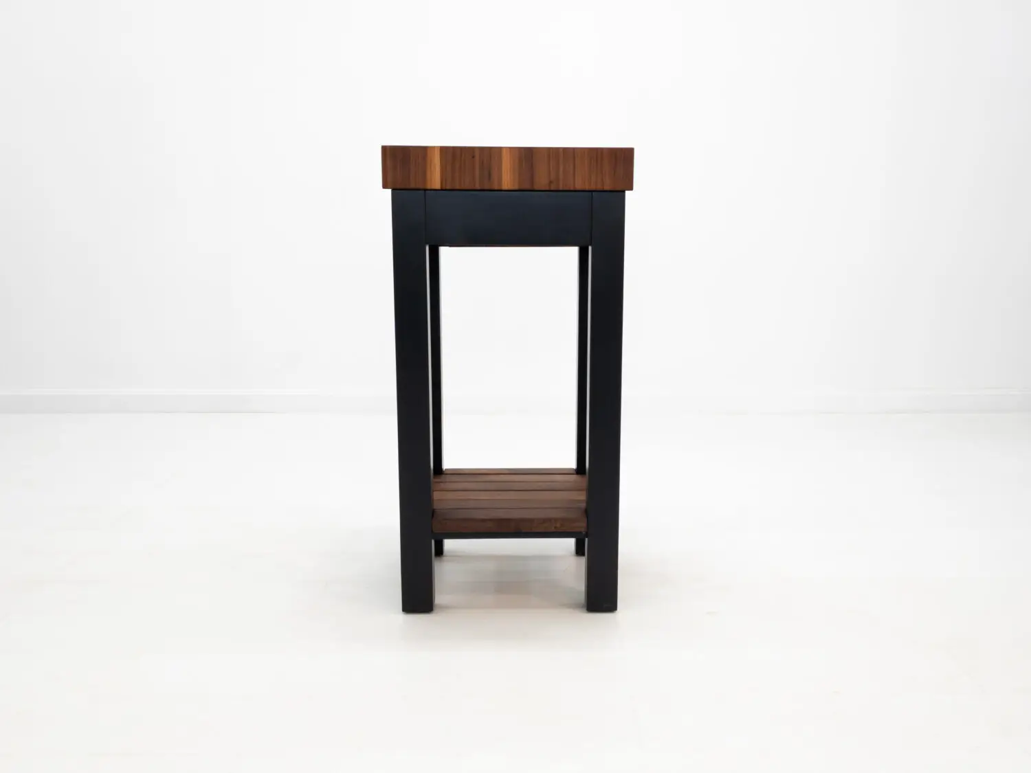 Front view of LUCA kitchen island showing drawer and painted black base