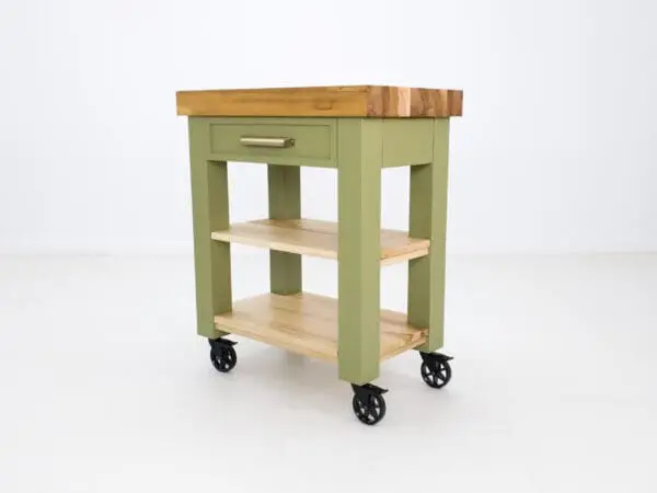 Green kitchen cart with wooden top.