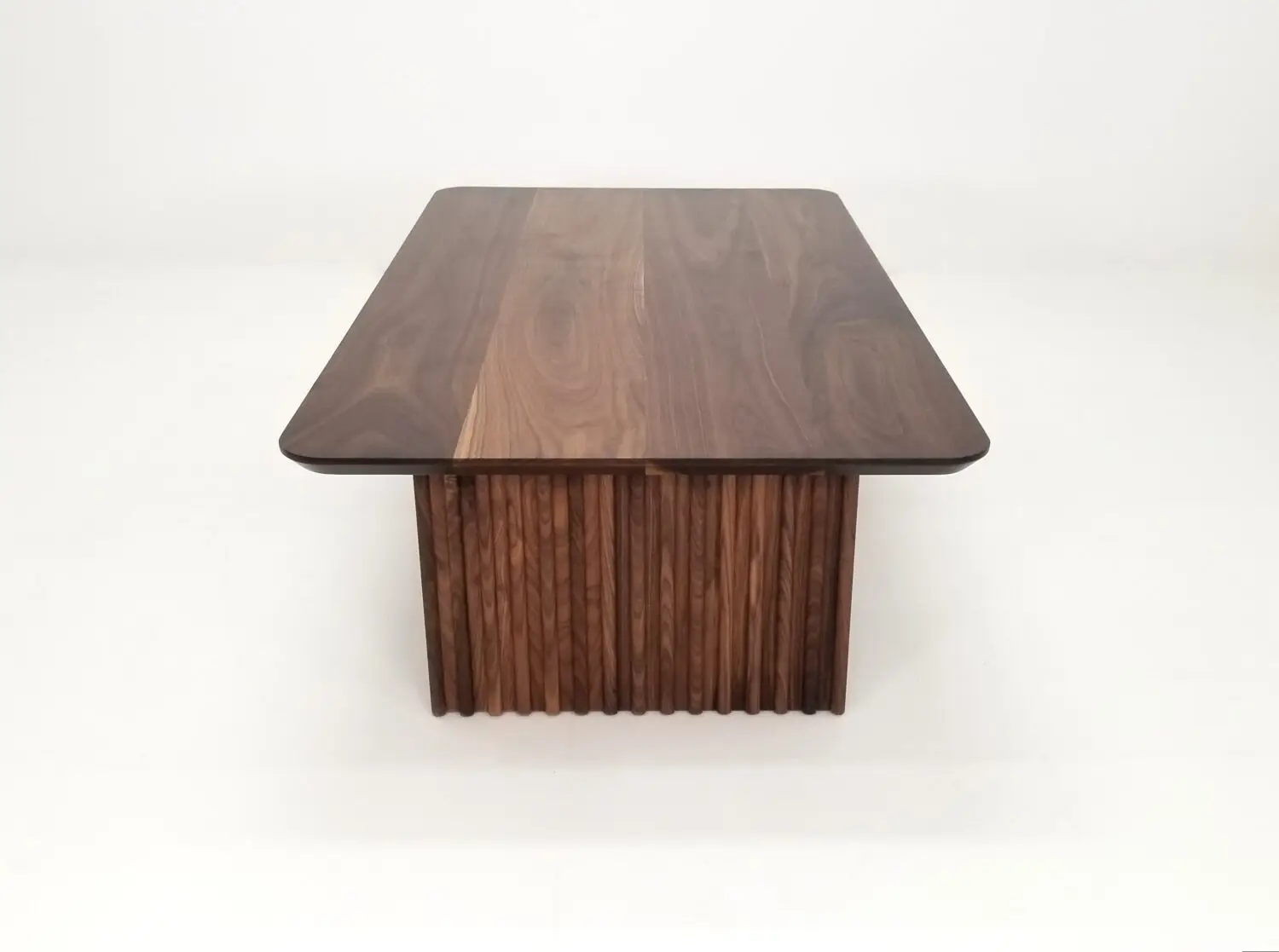 OWEN coffee table in solid walnut with a 1¼ inch thick tabletop and rounded corners