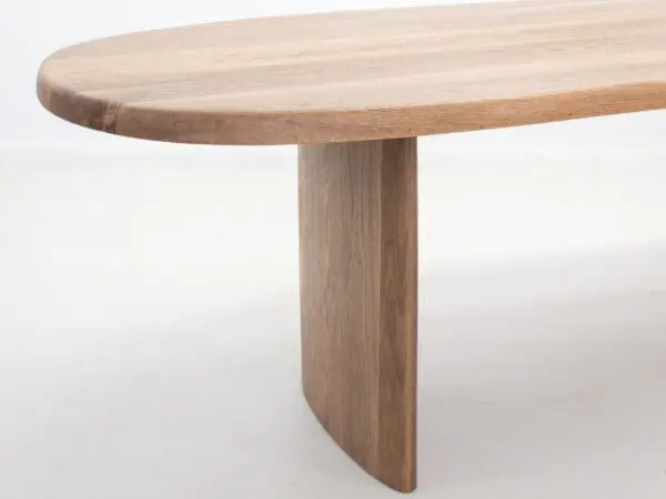 A close up of a freeform dining table.