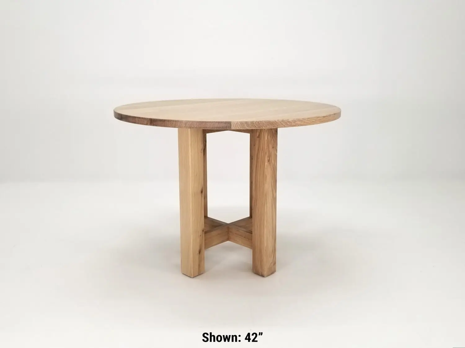 Solid wood round dining table with cross pedestal base handcrafted from American hardwood