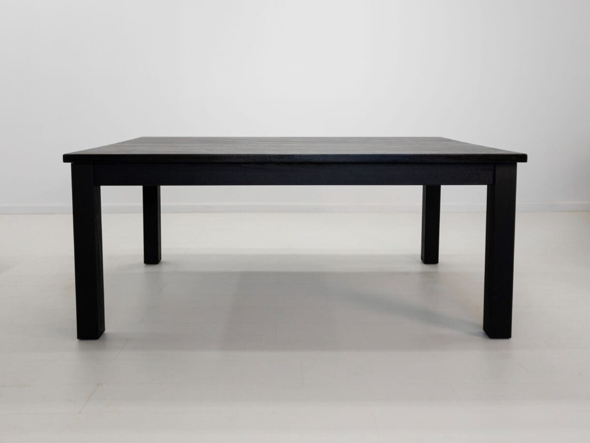 A JONA dining table in blackened ash