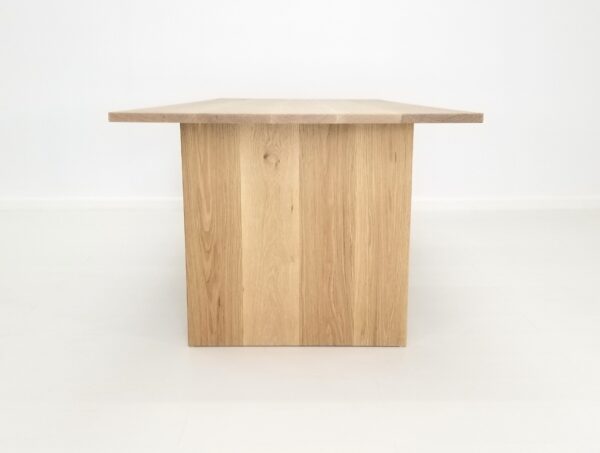 A white oak panel dining table.