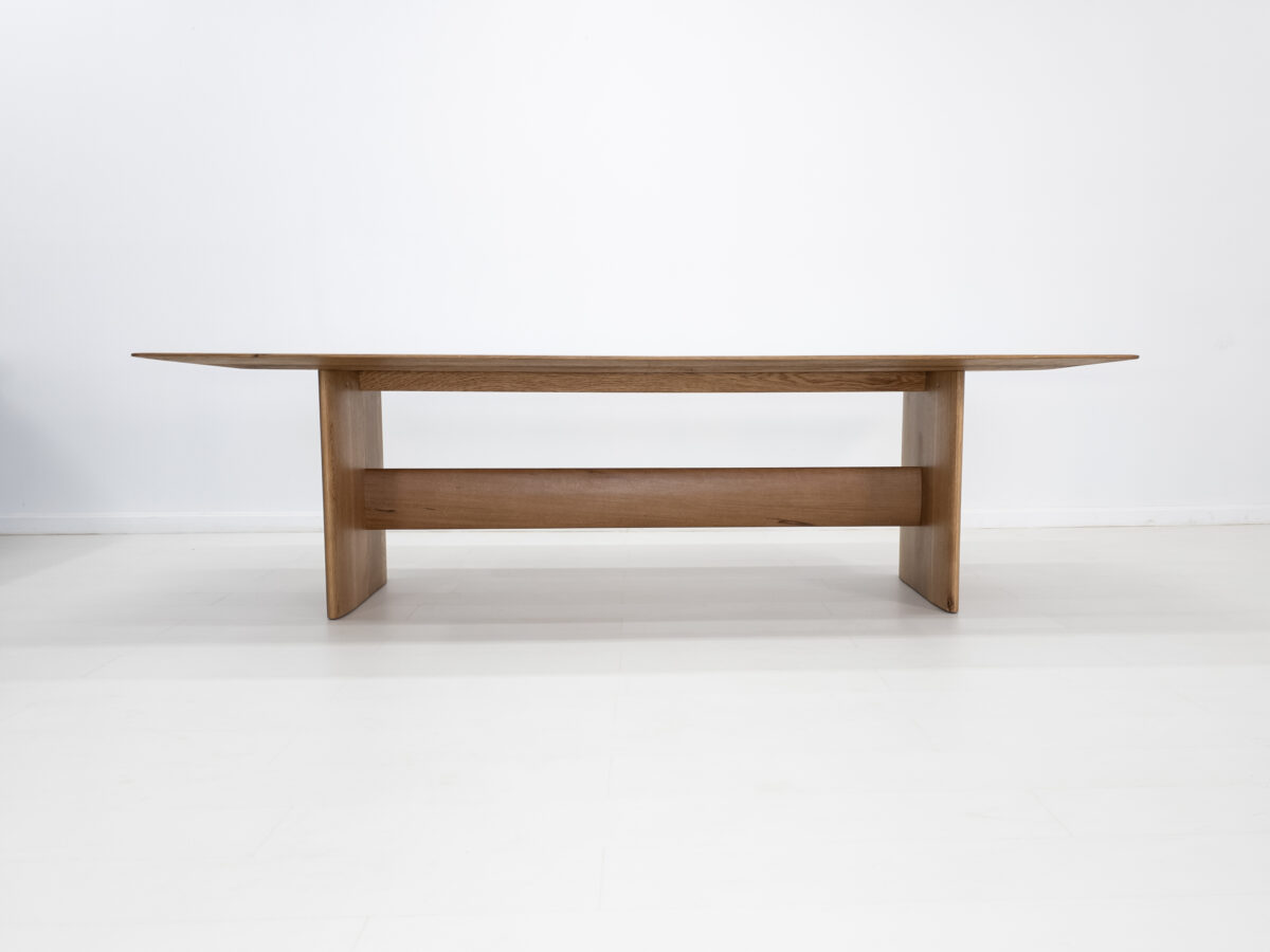 THEO dining table handcrafted from rift sawn white oak with a 1⅜ inch thick under beveled edge tabletop
