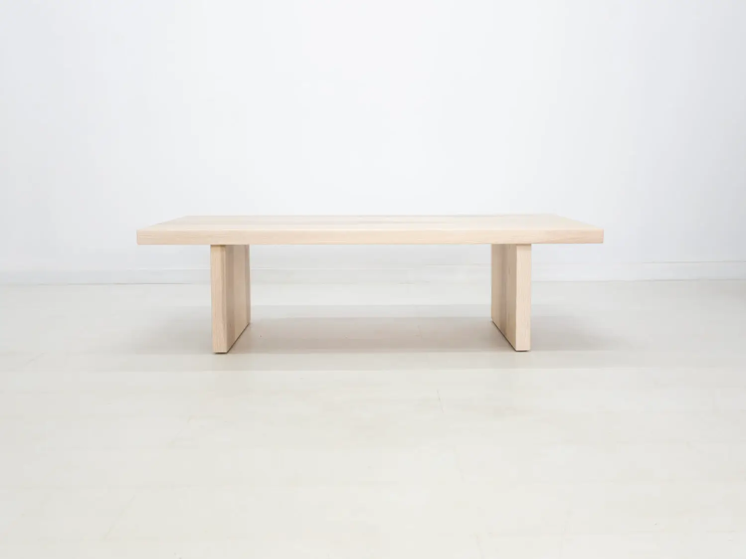 Side view of the LILY coffee table in sunwashed ash showcasing its clean lines and minimalist design