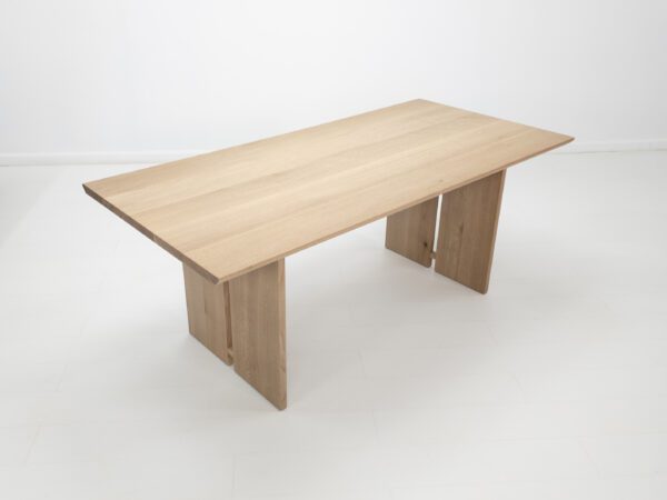 A wooden table with a natural finish.