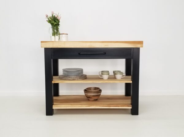 A LOLO butcher block kitchen island with two shelves and a vase.
