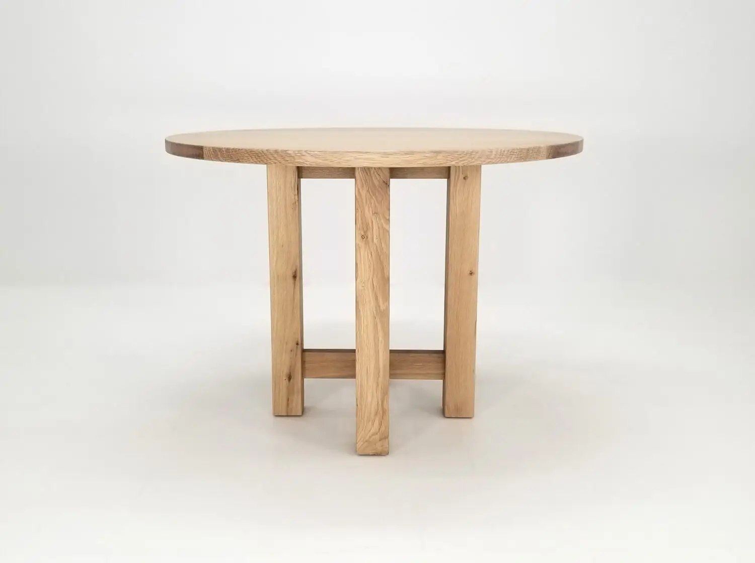 Solid wood round dining table with cross pedestal base handcrafted from American hardwood