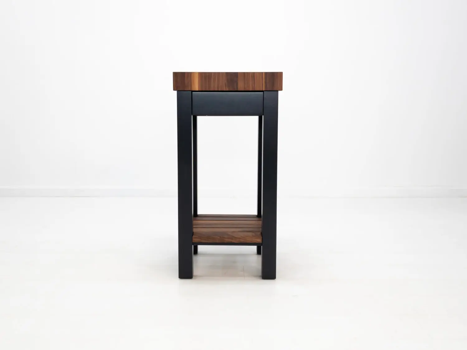 Front view of LUCA kitchen island showing drawer and painted black base