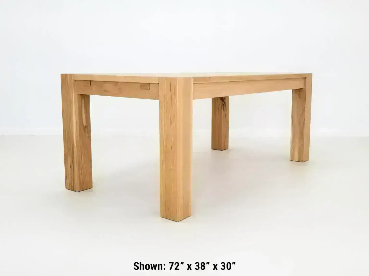 JAQI dining table handcrafted in natural white oak with seamless top and breadboard ends