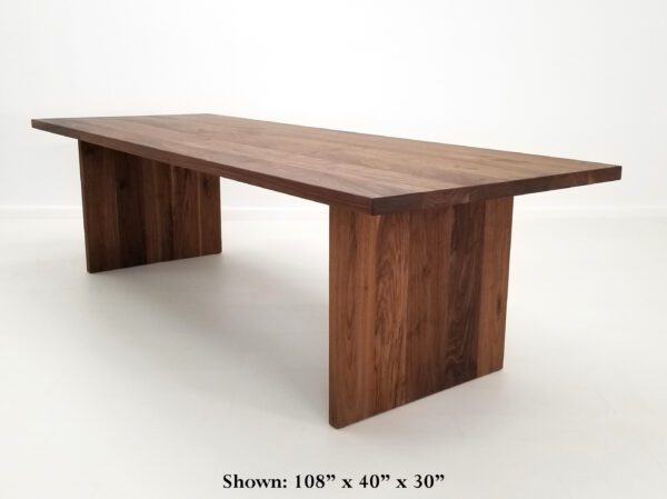 A large 2" thick walnut dining table.