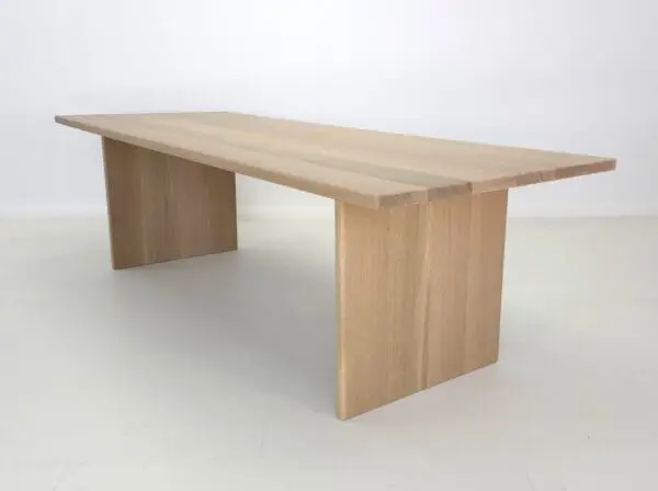 A white oak panel dining table.