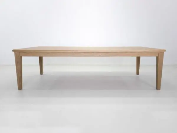 Wooden dining table with four legs.