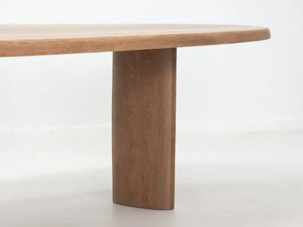 A close up of a freeform dining table.