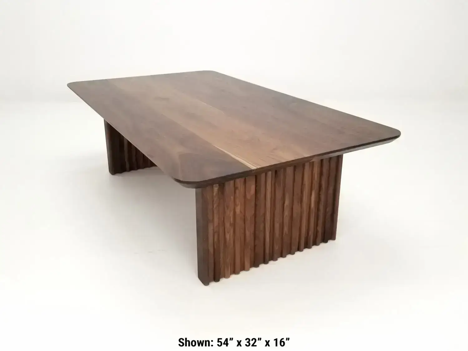 OWEN coffee table in solid walnut with a 1¼ inch thick tabletop and rounded corners