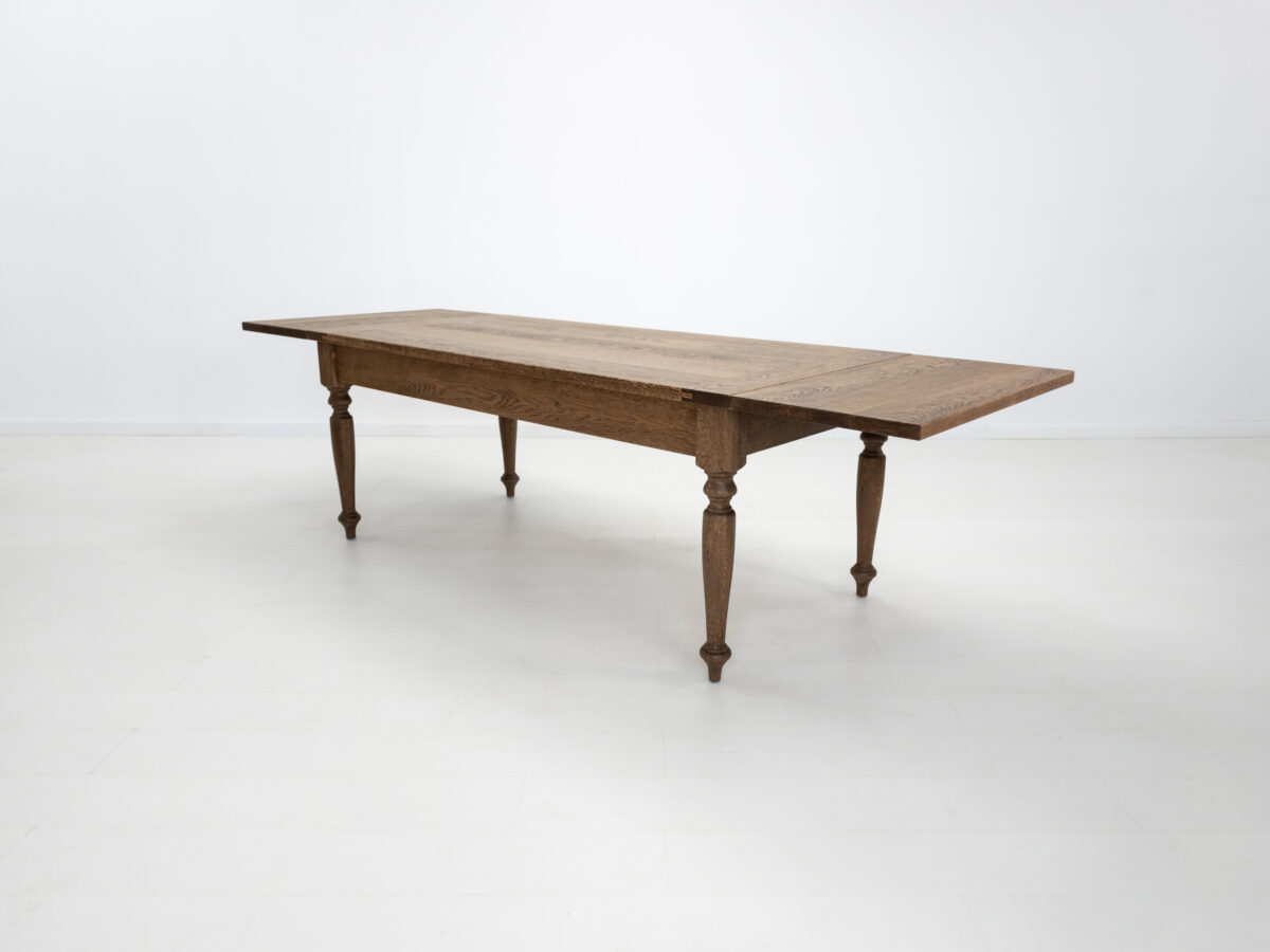 Handcrafted farmhouse table with turned legs and two drawers made from solid American white oak
